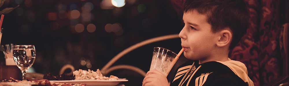 kid eating at restaurant